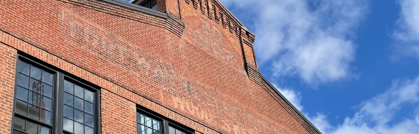 Looking up at old brickworks building